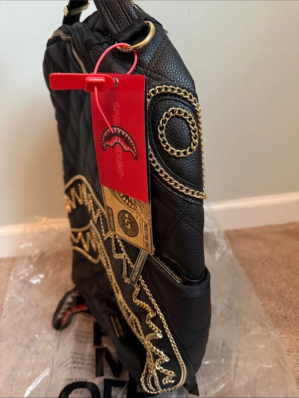 Quilted Black Backpack with Gold Chain Trim